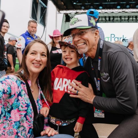 NASCAR legend Kyle Petty poses for a selfie with race fans before the EchoPark Automotive Grand Prix NASCAR Cup Series race at Circuit of The Americas in Austin, Texas on Sunday, March 24, 2024.